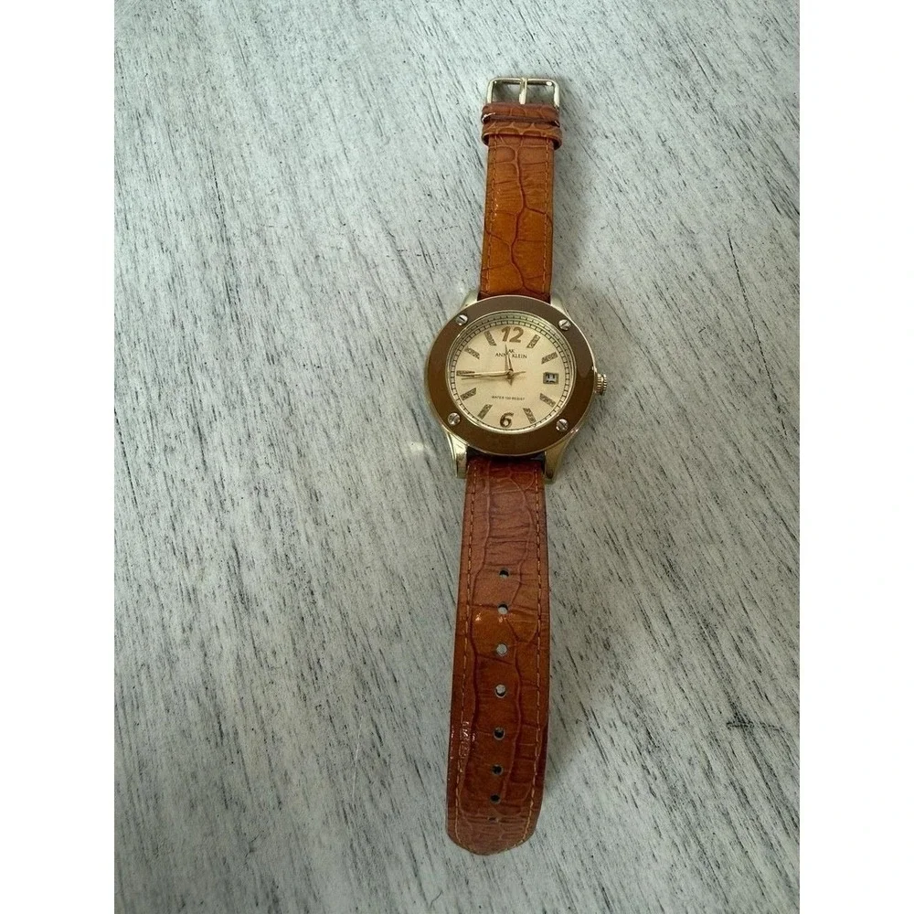 Anne Klein 10/9054 Women Gold Tone Quartz Watch Crystal Brown Enamel Bezel